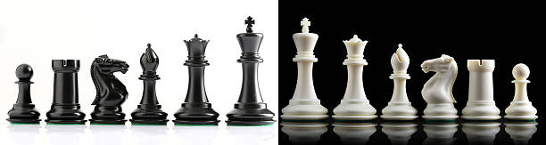 istock chess pieces on chessboard on marble background. game of chess 2210409347
