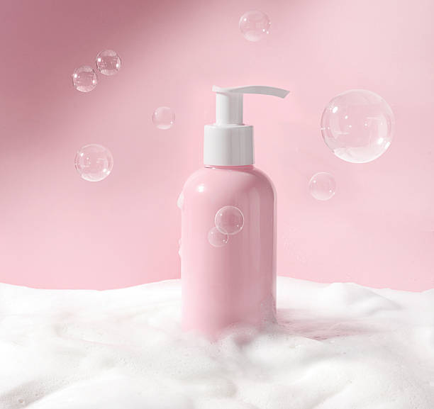 istock Elegant Pink Pump Bottle Beautifully Surrounded by Soft, Luxurious Foam 2210410603