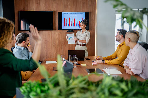 istock Businesswoman presenting ideas to her team 2210413158