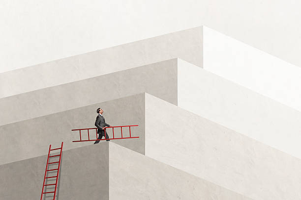 Man Using Ladder To Reach His Goal