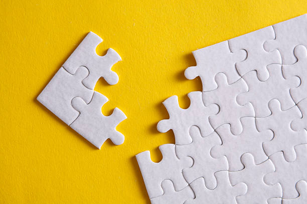 istock White blank square Jigsaw puzzle pieces disassembled
on yellow background. Mockup for design 2210420167