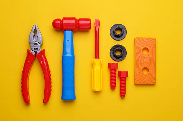 istock Set of children's toy tools on a yellow background. Flat lay 2210421022