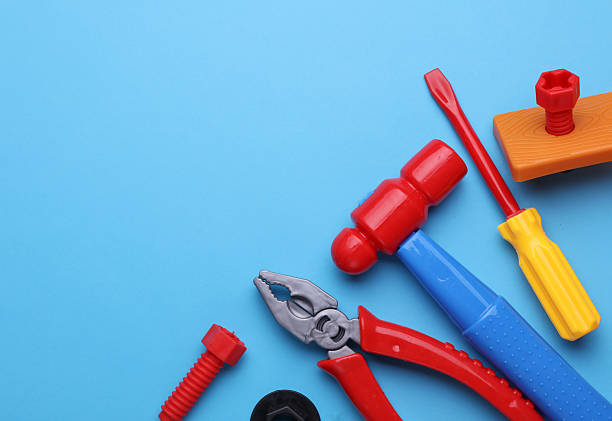 istock Set of children's toy tools on a blue background. Flat lay 2210421041