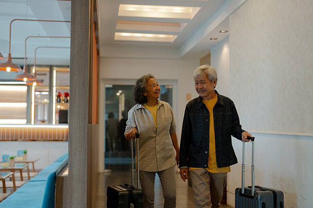 istock Couple arriving at the hotel while traveling 2210421514