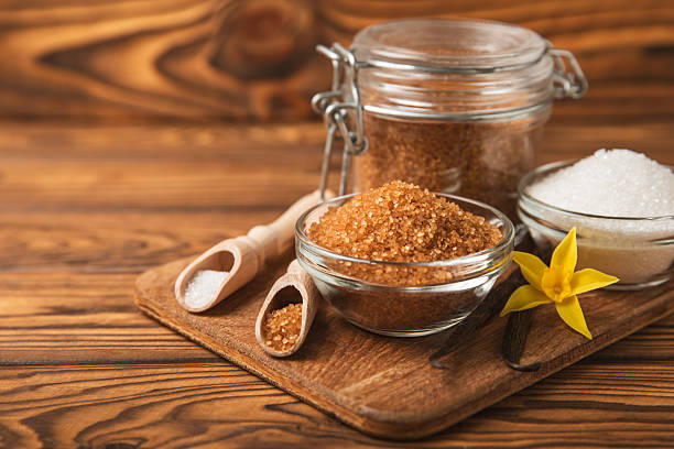 istock Aromatic vanilla sugar. Vanilla pods. Vanilla sticks, brown and white sugar in a bowl on a textured background. Vanilla flowers, spices and herbs for desserts and baking. Space for text. Copy space 2210428124