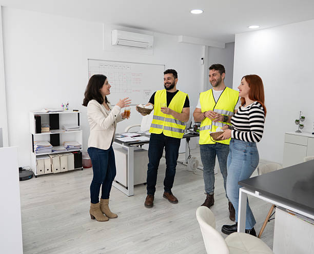 istock Warehouse coworkers and office workers having snacks together after work and flirting 2210430210