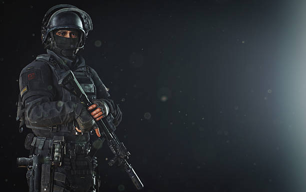 istock Professional Soldier in Tactical Gear on Dark Background 2210443342
