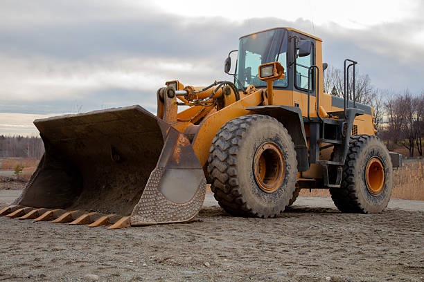 istock Yellow Loader With Wide Shovel At Construction Site 2210444708