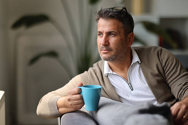 istock Pensive lost in thoughts suffering from depression 2210445579
