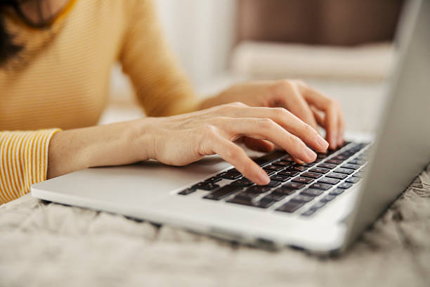 istock Close up of hands typing on a laptop. 2210452981