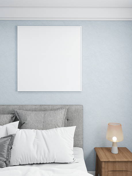 istock Blank square frame in a minimalist bedroom with blue walls and light-toned decor 2210456965