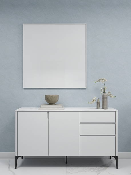 istock Minimalist living room with a square frame on a blue wall, a sideboard, and decorations 2210457060