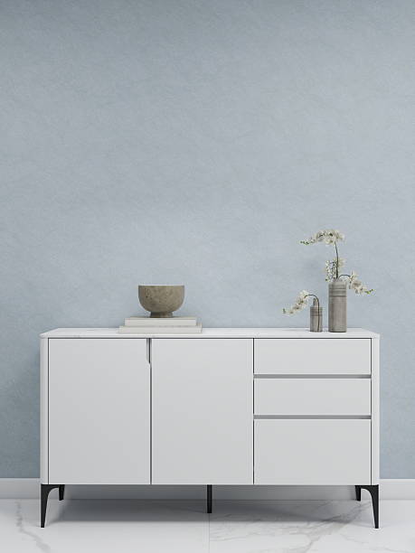 Blue wall mockup with a white sideboard and decorations