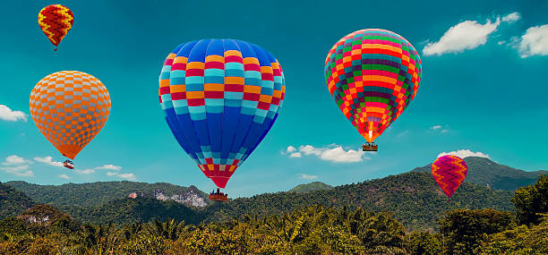 istock Hot Air balloons flying mountain 2210459937