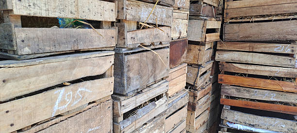 istock pile of used wooden boxes 2210459958