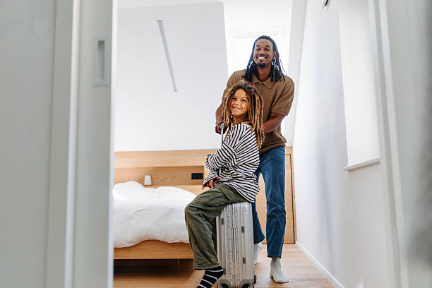 istock Father and Multiracial Son Packing for Vacation at Home 2210464017