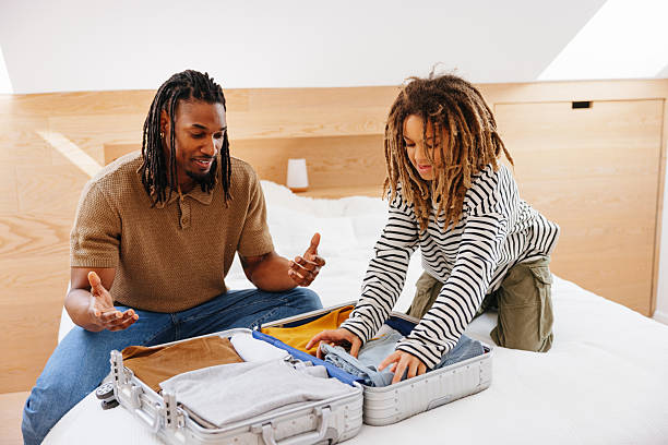 istock Father and Son Packing for Vacation Together at Home 2210464045