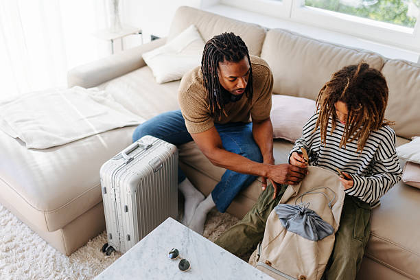 istock Father and Multiracial Son Packing for a Trip Together at Home 2210464059