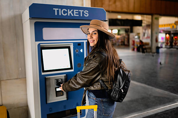 istock A woman buys a train ticket 2210469423