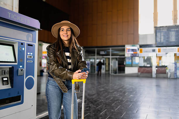 istock A woman buys a train ticket 2210469802
