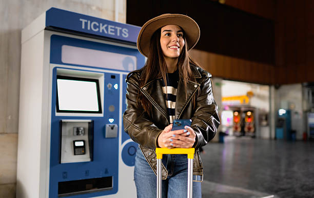 istock A woman buys a train ticket 2210469862