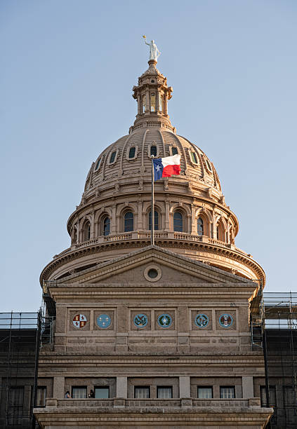 istock Texas State Capitol dome and flag with scaffolding from renovation work 2210473801