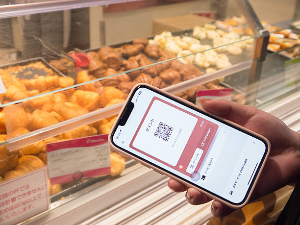 istock smartphone scan a QR code and make a payment in a supermarket 2210475923