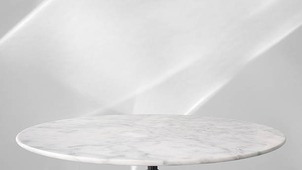 istock Round marble table top with abstract shadow drop on white wall background for mockup product display 2210476242