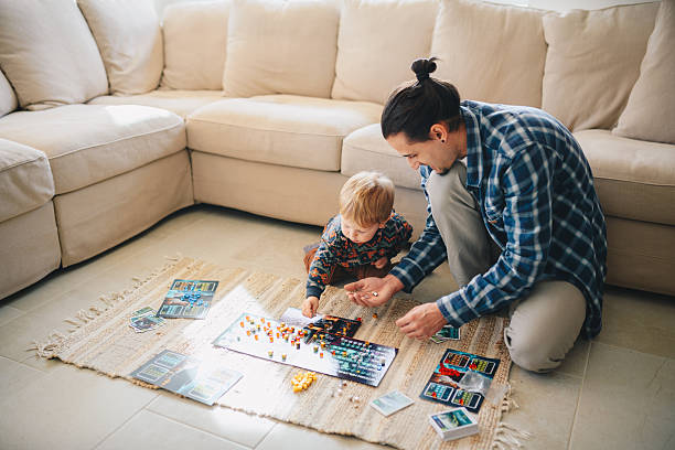 istock Father showing his boy a game he has made. 2210477259