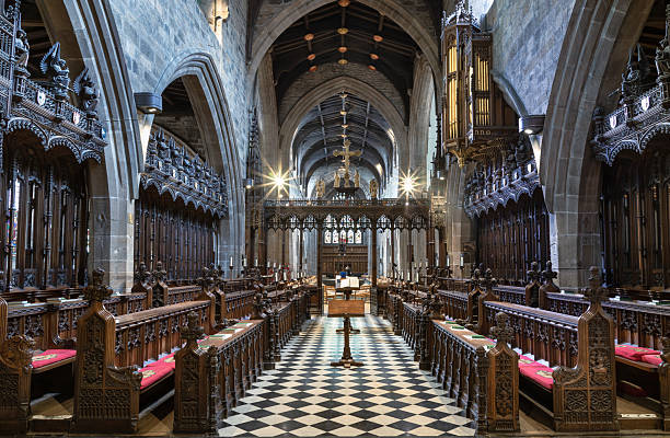 A choir practicing Christmas carols in St Paul’s Church, Covent Garden in Central London. St Paul’s Church is known as “The Actors’ Church” because of its position in London’s Theatreland and it contains many memorials to stars of screen, stage, music and the arts. It was designed by Inigo Jones and dates from 1633.