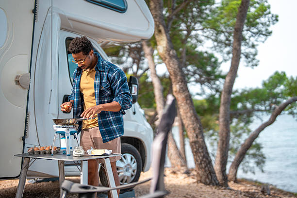 istock Casual Weekend Breakfast Preparation Near Seaside Camping With Motorhome 2210477637