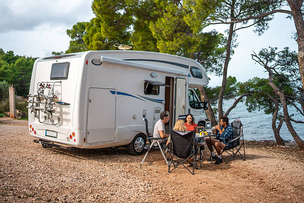 istock Seaside Breakfast Gathering With Friends Around Parked Coastal Motor Home 2210477638