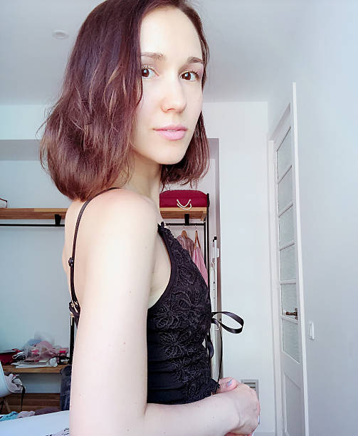 istock Nice beautiful brown-haired girl, smiling and taking a selfie. 2210478505