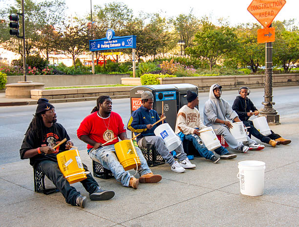 Chicago, IL, USA - October 18, 2015: Buskers drumming on plastic buckets across from Grant Park in Chicago