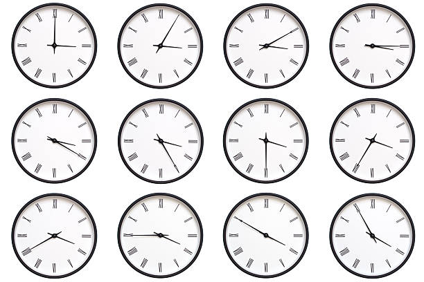 istock A set of 12 wall clocks with black frames and Roman numerals, each displaying a different time from 03:00 to 03:55 or 15:00 to 15:55. ideal for timekeeping, schedule management, and daily routines. 2210485801