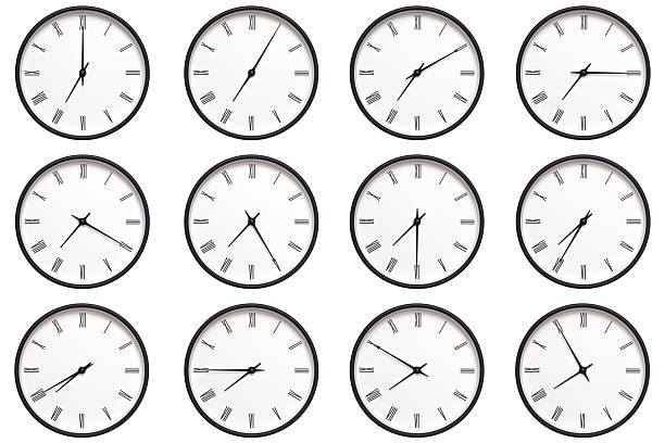 istock A set of 12 wall clocks with black frames and Roman numerals, each displaying a different time from 07:00 to 07:55 or 19:00 to 19:55. ideal for timekeeping, schedule management, and daily routines. 2210485833