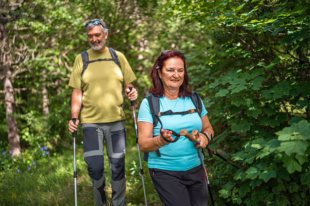 istock Active Senior Couple on Forest Hike 2210486104