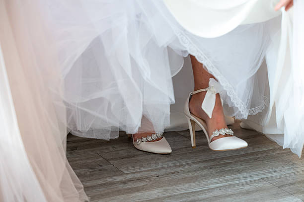 istock Bride's Elegant Heels and Tulle Wedding Dress 2210488815