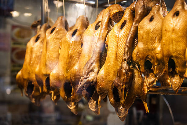 Cooked ducks hang in the restaurant display.Hong Kong Island.
