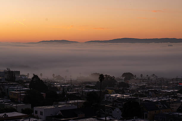 istock Fog envelops San Francisco at sunrise, creating a serene urban landscape 2210491596