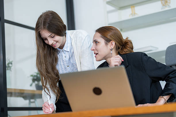 istock Colleagues collaborating in modern office environment focused on project discussion and brainstorming session 2210496304