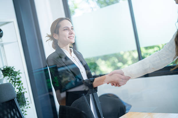 istock Business meeting highlights collaboration and partnership between two professionals in a modern office setting 2210496439