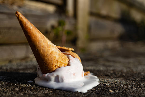 istock ice cream cone crashing on the floor dripping with melted ice cream 2210496613