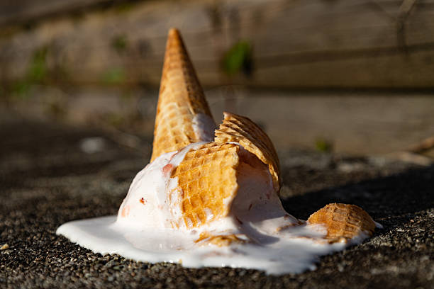 istock ice cream cone crashing on the floor dripping with melted ice cream 2210496640