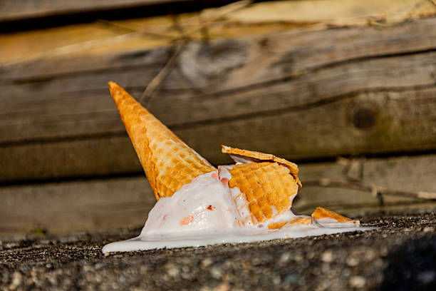 istock ice cream cone crashing on the floor dripping with melted ice cream 2210496668