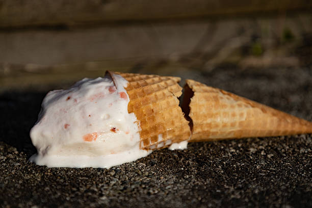 istock ice cream cone crashing on the floor dripping with melted ice cream 2210496730