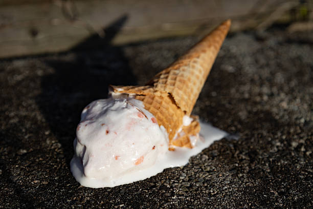 istock ice cream cone crashing on the floor dripping with melted ice cream 2210496749