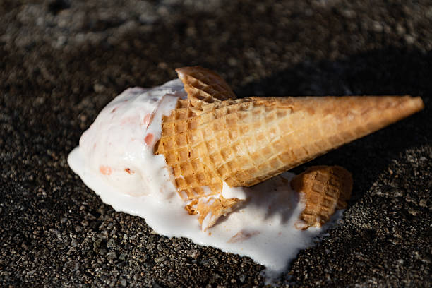 istock ice cream cone crashing on the floor dripping with melted ice cream 2210496795