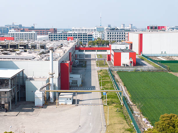 Wolfsburg, Gemany - June 17, 2025: Modern architecture by the water in Wolfsburg's Autostadt and VW Power Plant during evening light