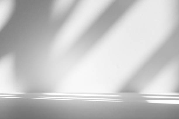 istock Wall interior background, studio and backdrops show products.with shadow from window color white . background for text insertion and presentation product 2210498442